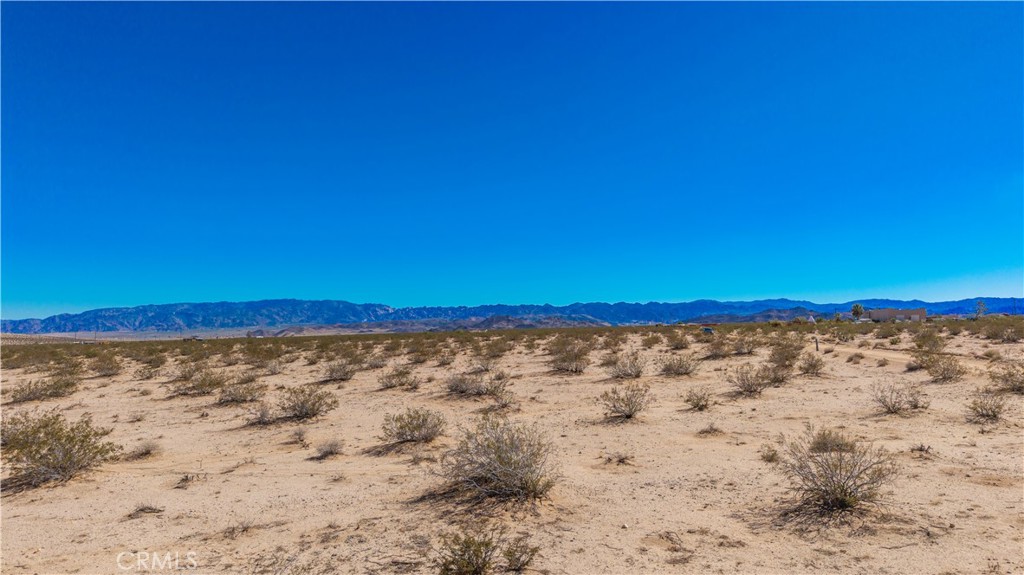 77 Copper Moon Lane Joshua Tree, CA 92252 - Photo 18 of 24 a view of ocean with beach