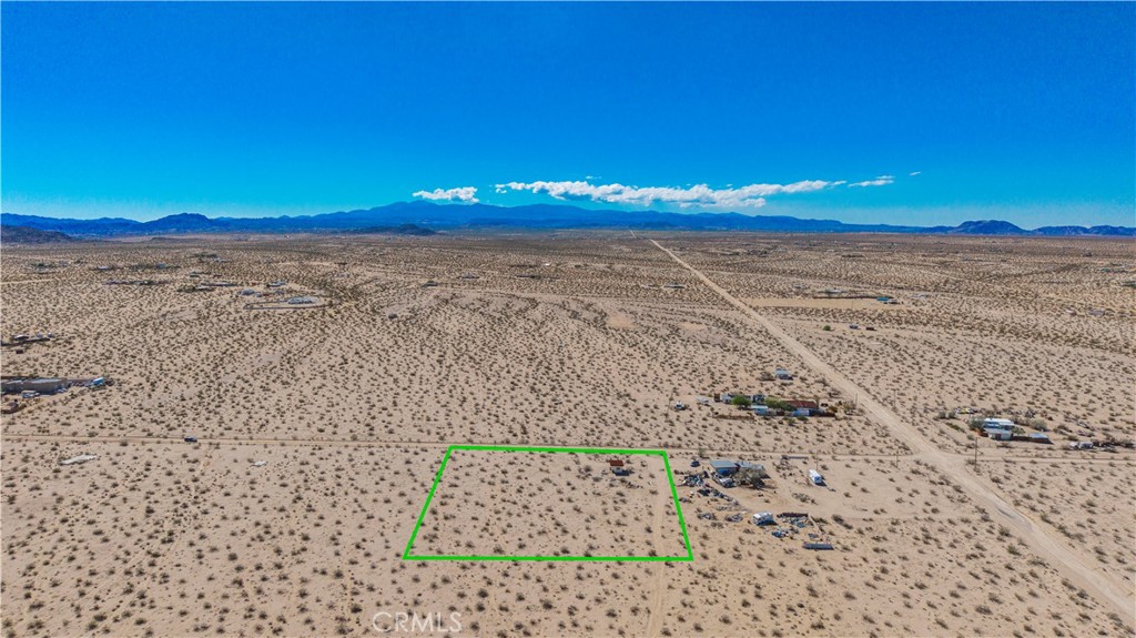 77 Copper Moon Lane Joshua Tree, CA 92252 - Photo 23 of 24 a view of a pathway with a building in the background