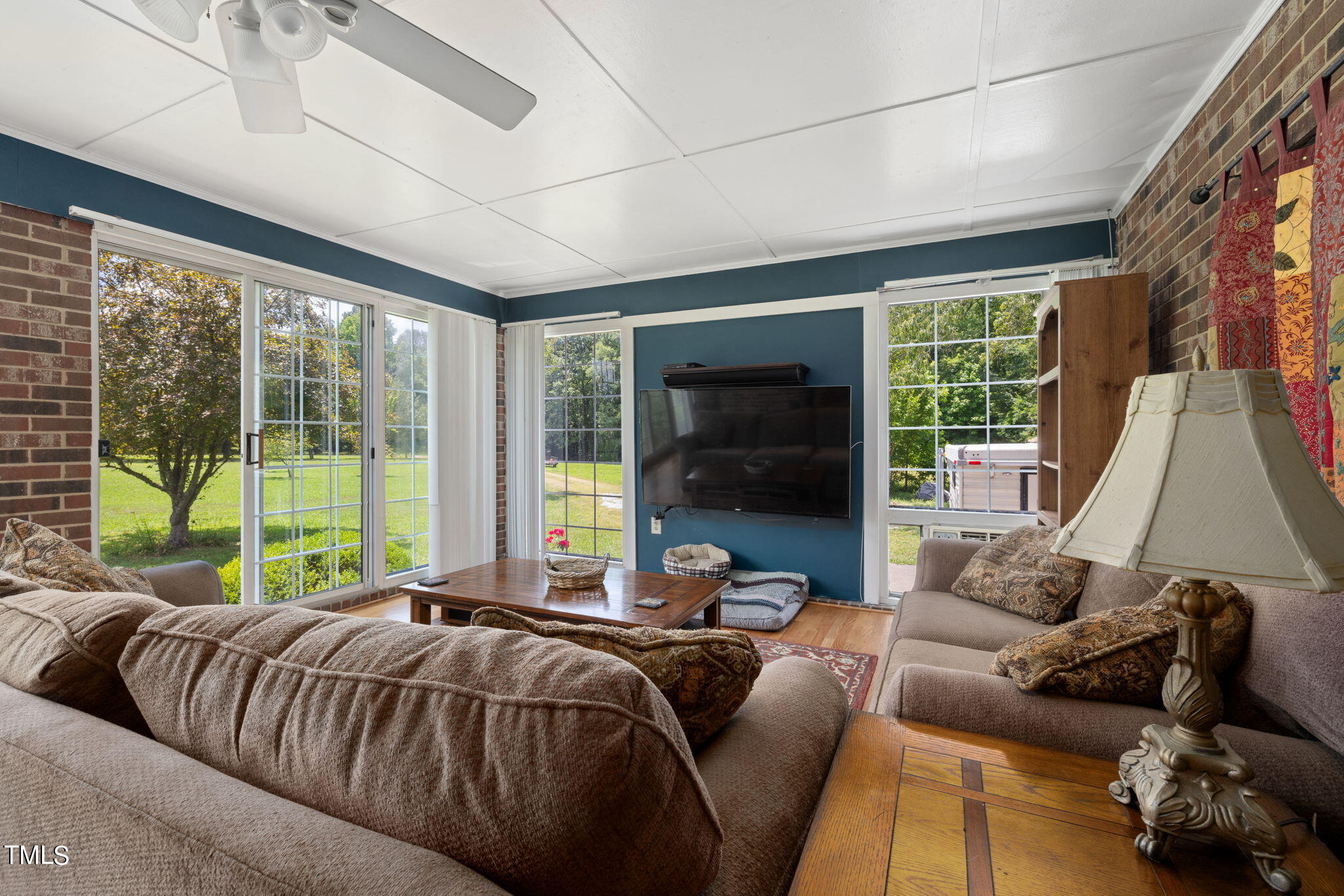 212 Hawkins Road Cedar Grove, NC 27231 - Photo 11 of 36 a bed sitting in a bedroom next to a large window