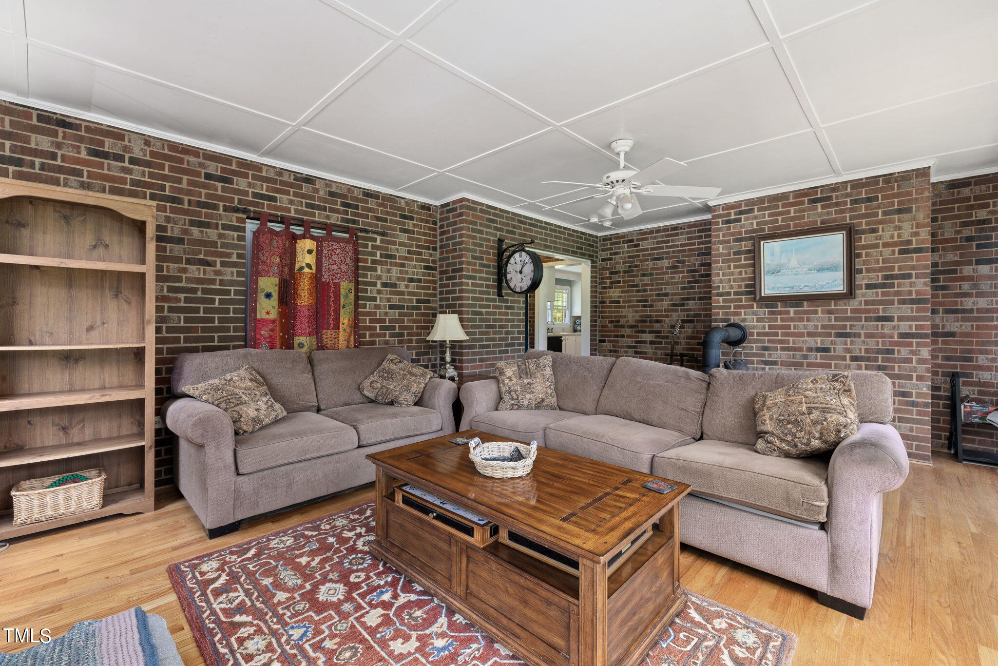 212 Hawkins Road Cedar Grove, NC 27231 - Photo 13 of 36 a living room with furniture and a fireplace