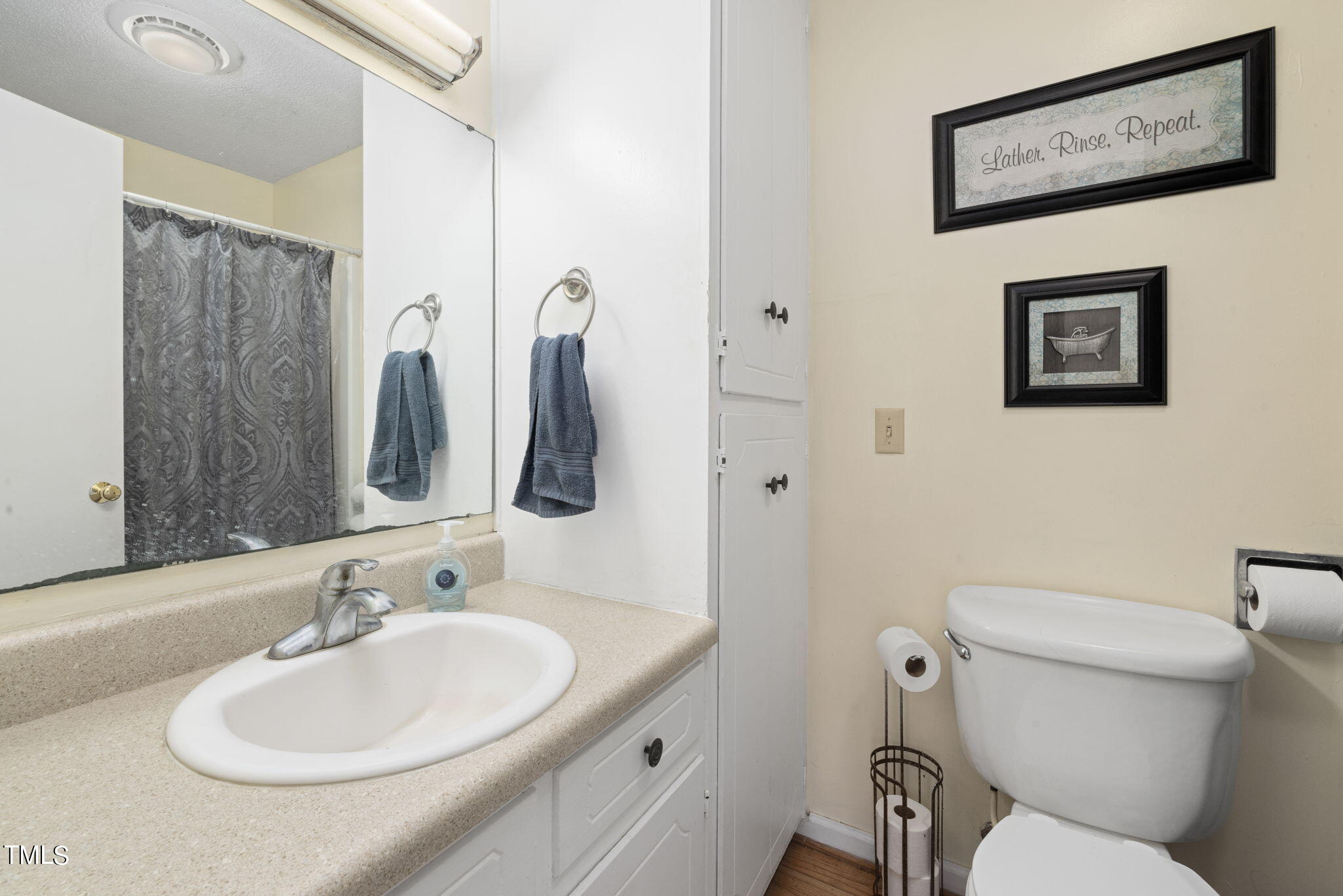 212 Hawkins Road Cedar Grove, NC 27231 - Photo 15 of 36 a bathroom with a toilet sink and mirror