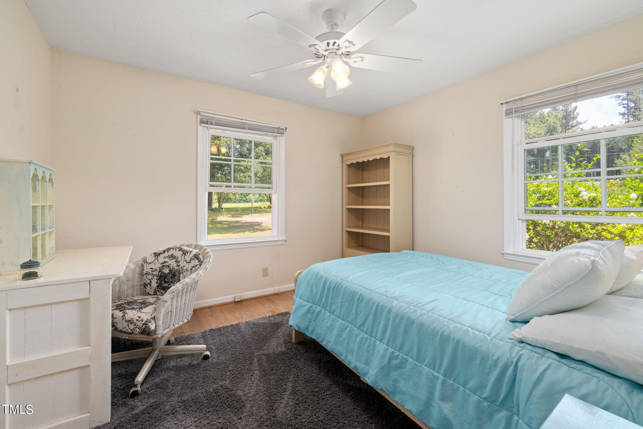 212 Hawkins Road Cedar Grove, NC 27231 - Photo 16 of 36 a bedroom with a bed and a window
