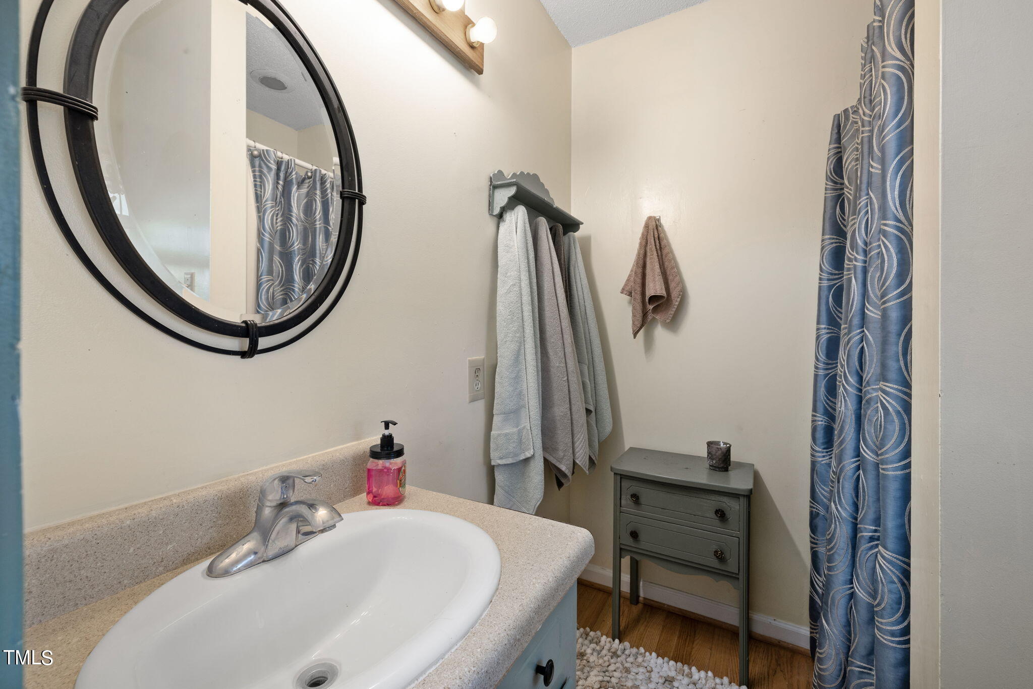 212 Hawkins Road Cedar Grove, NC 27231 - Photo 18 of 36 a bathroom with a sink and a mirror