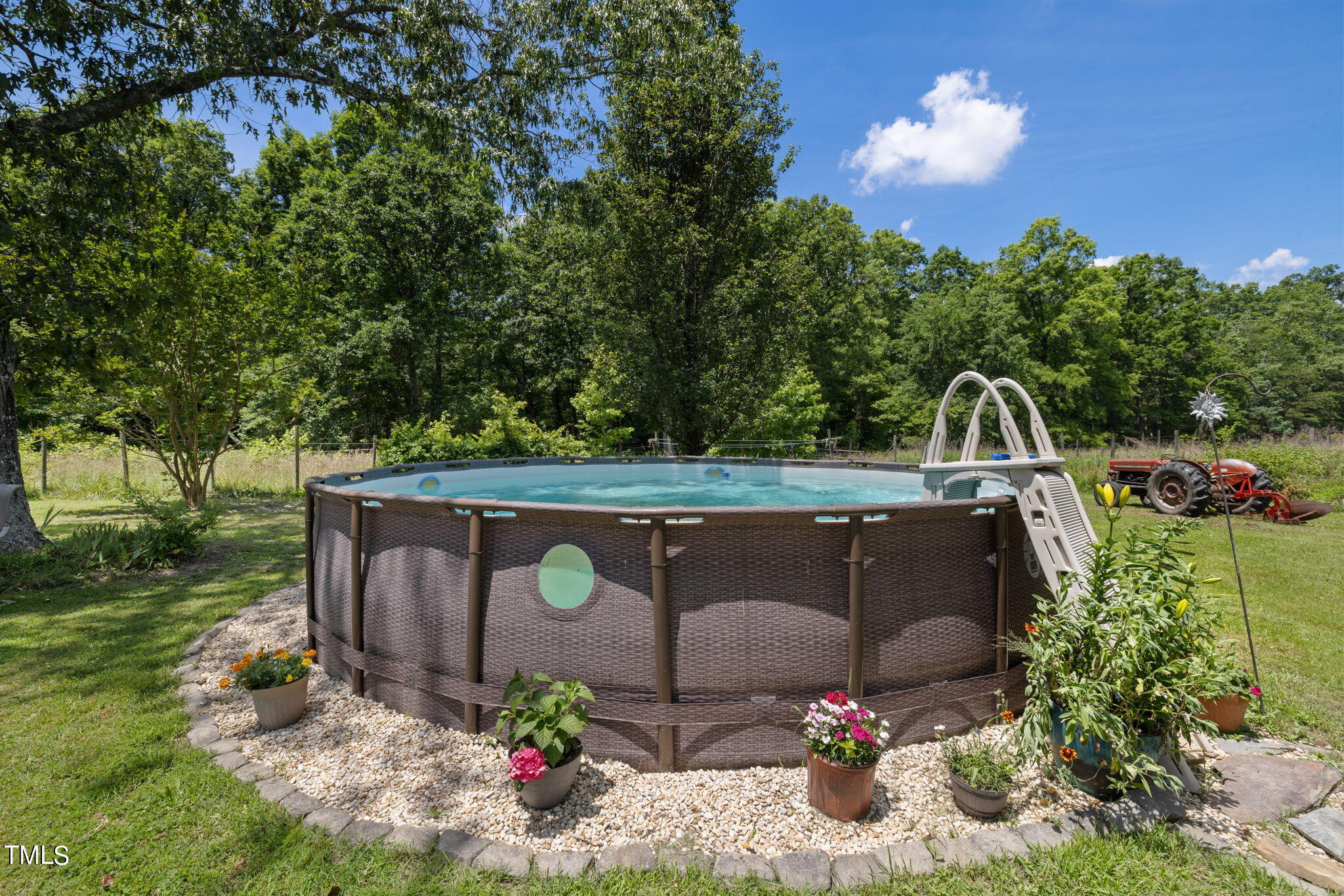 212 Hawkins Road Cedar Grove, NC 27231 - Photo 22 of 36 a view of a couch in the garden