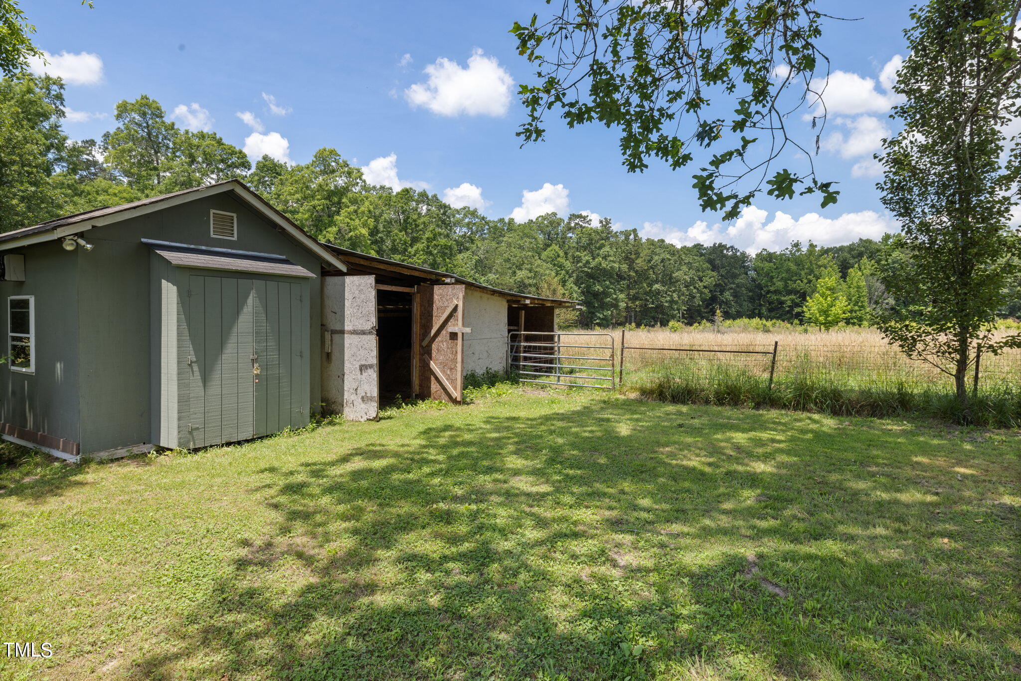 212 Hawkins Road Cedar Grove, NC 27231 - Photo 24 of 36 a backyard of a house with lots of green space