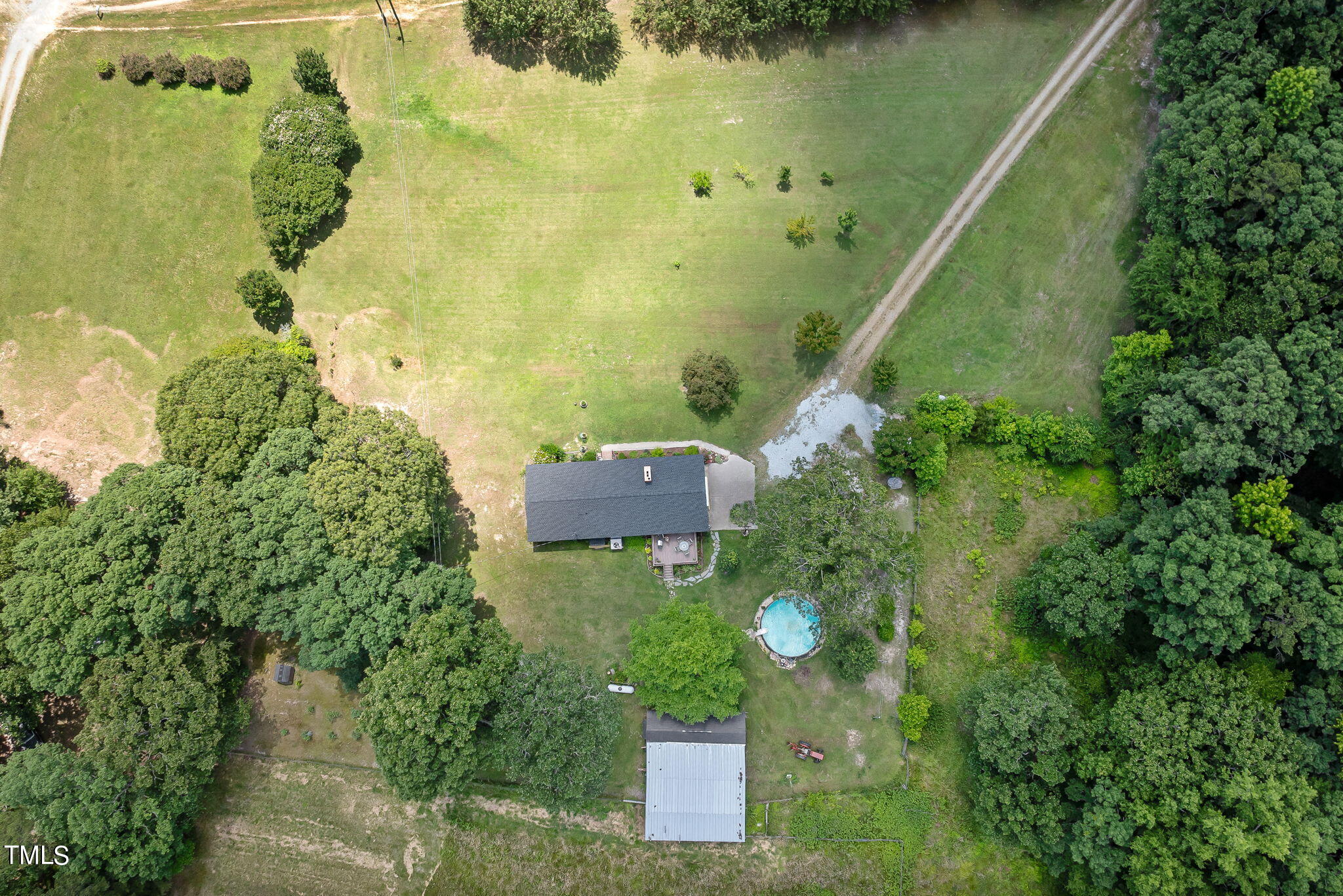 212 Hawkins Road Cedar Grove, NC 27231 - Photo 32 of 36 an aerial view of a residential houses with outdoor space and trees all around