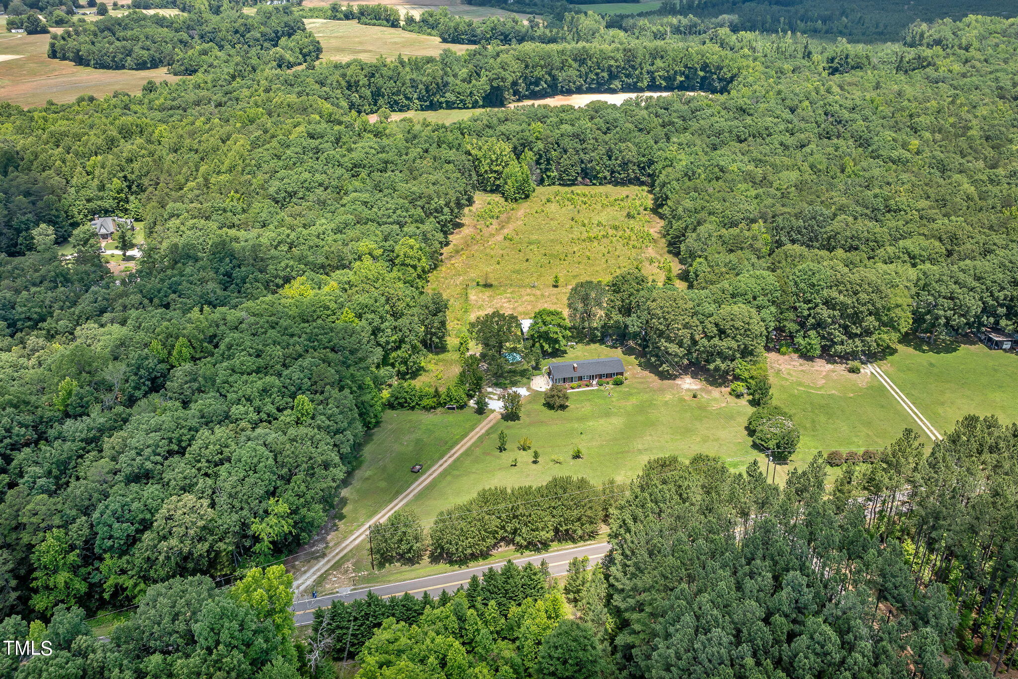 212 Hawkins Road Cedar Grove, NC 27231 - Photo 34 of 36 a view of a yard with a swimming pool and green space