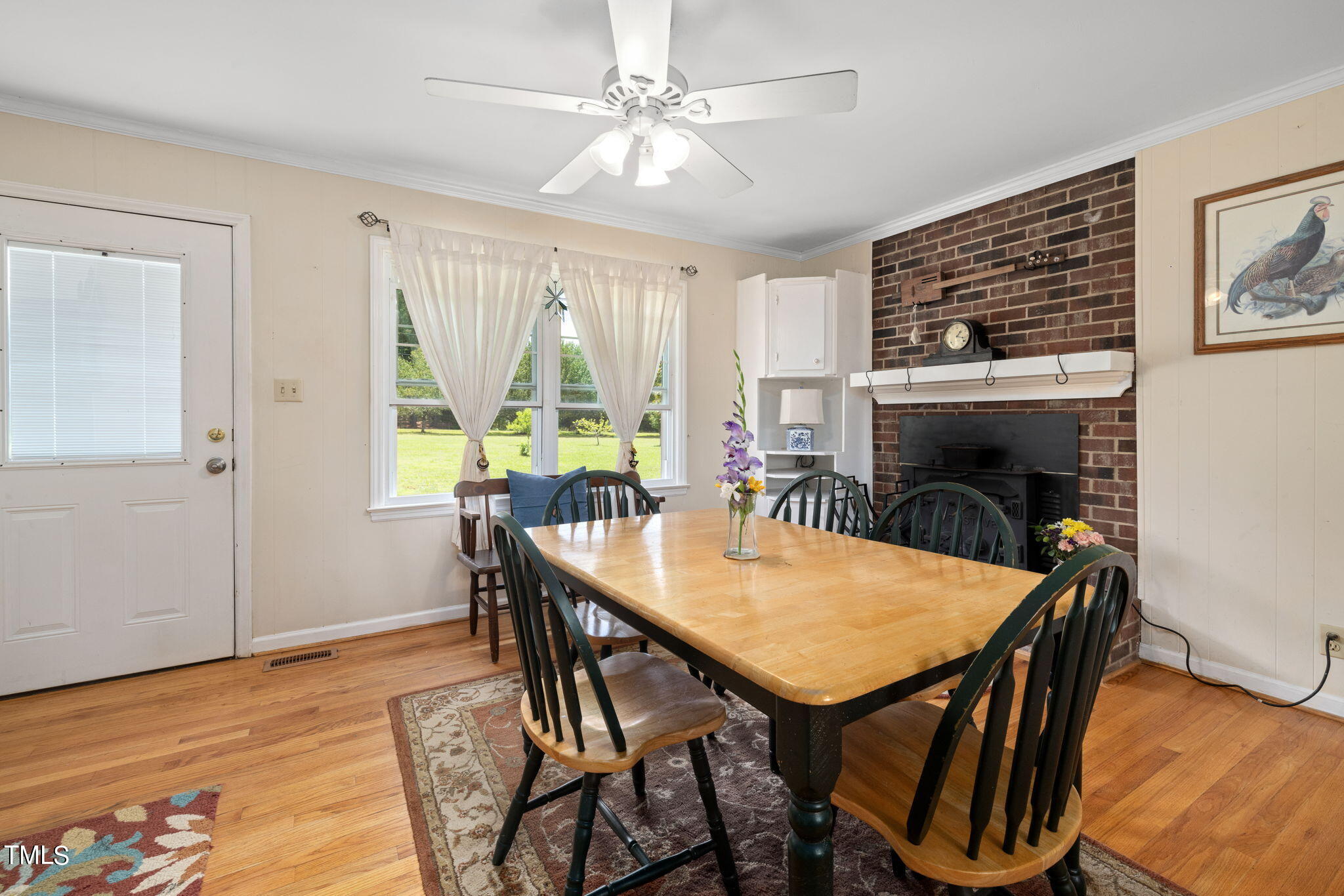 212 Hawkins Road Cedar Grove, NC 27231 - Photo 6 of 36 a view of a dining room with furniture window and wooden floor