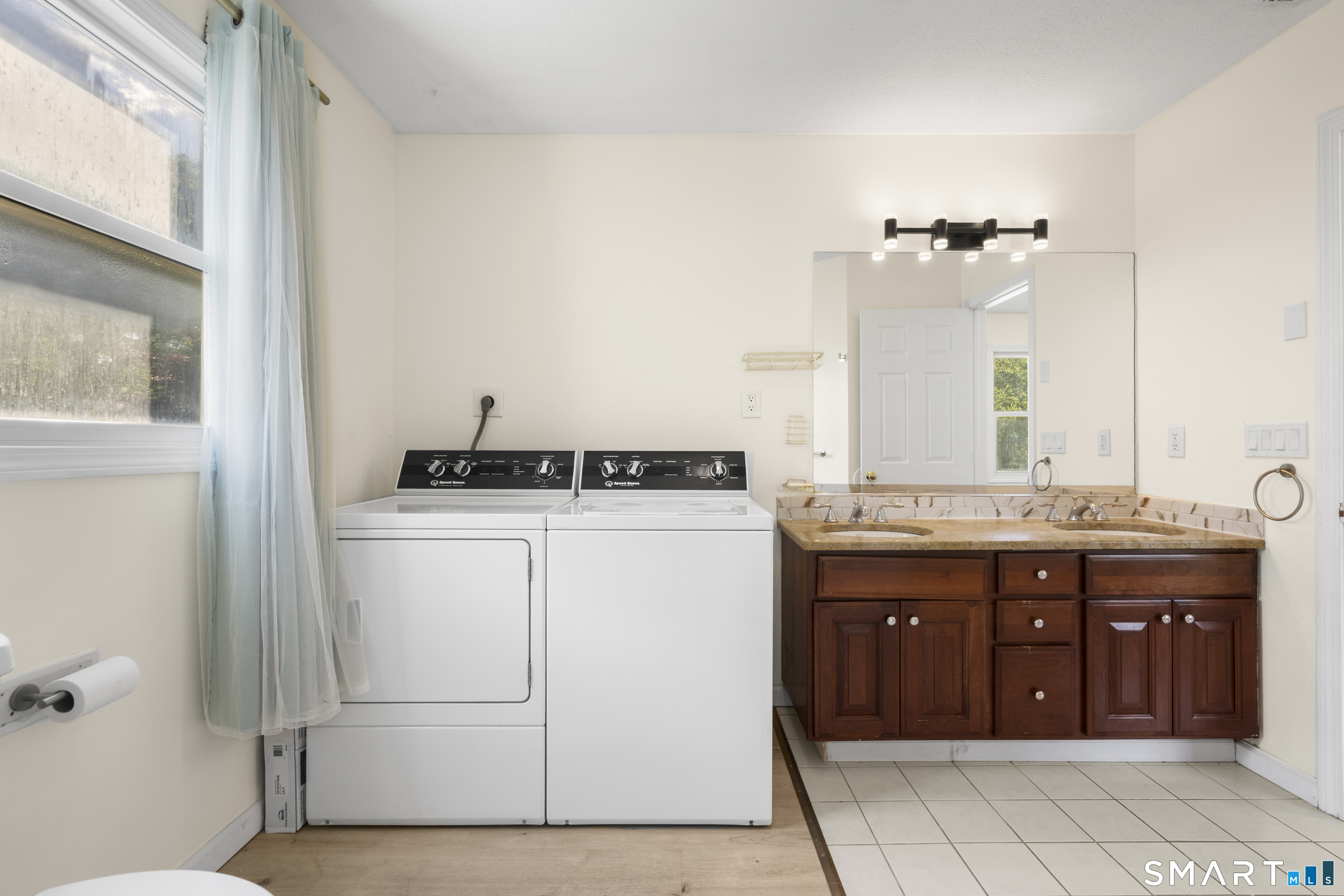 39 Joseph Lane Hamden, CT 06514 - Photo 25 of 40 a bathroom with a granite countertop sink and a mirror