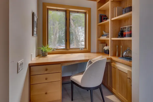 a room with a window and a chair