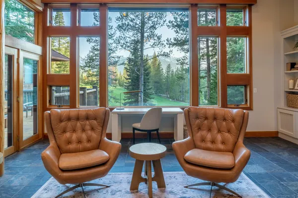 a room with furniture and a large window