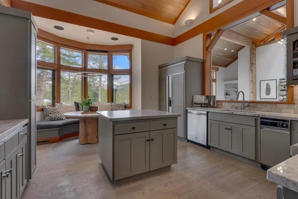 a kitchen with sink stove and cabinets