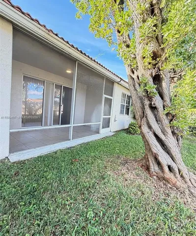 a house view with a backyard space