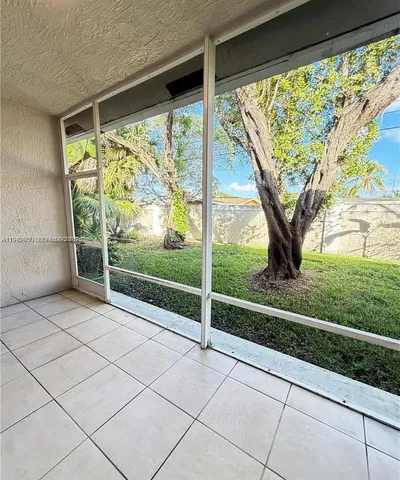 a view of a room with porch and wooden floor