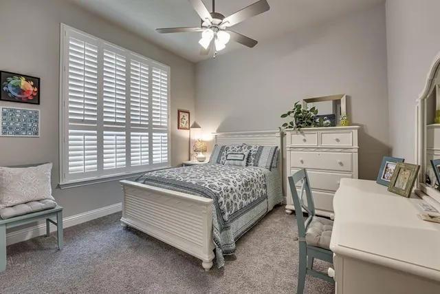 a spacious bathroom with a tub shower and toilet