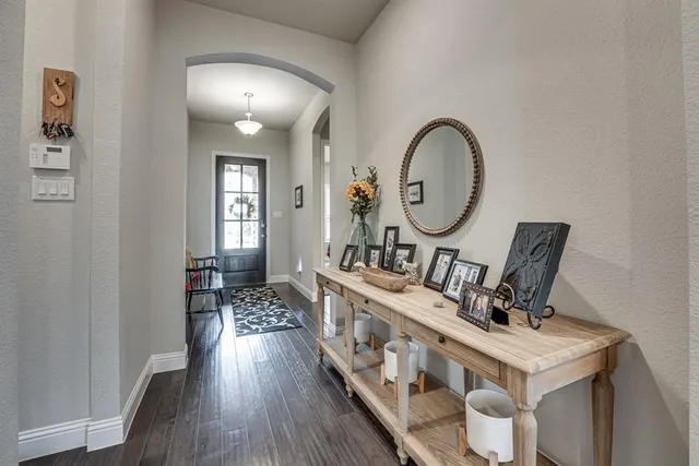 a view of living room and wooden floor