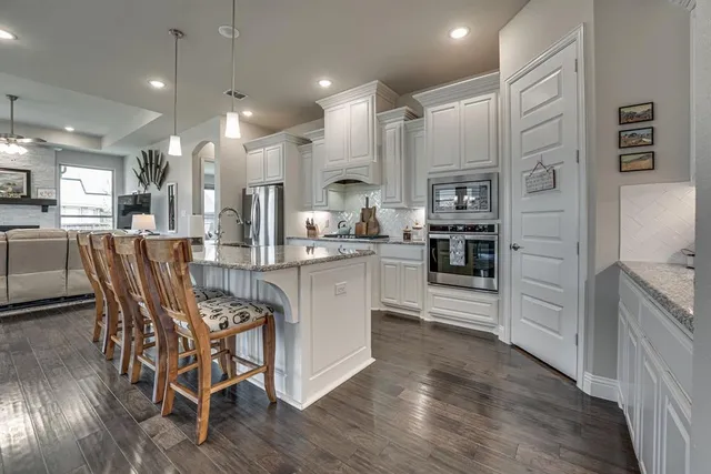 a view of small house with potted plants