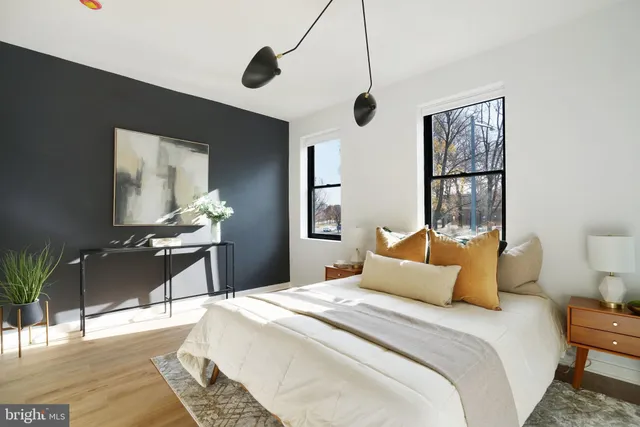 a bedroom with a bed and a table