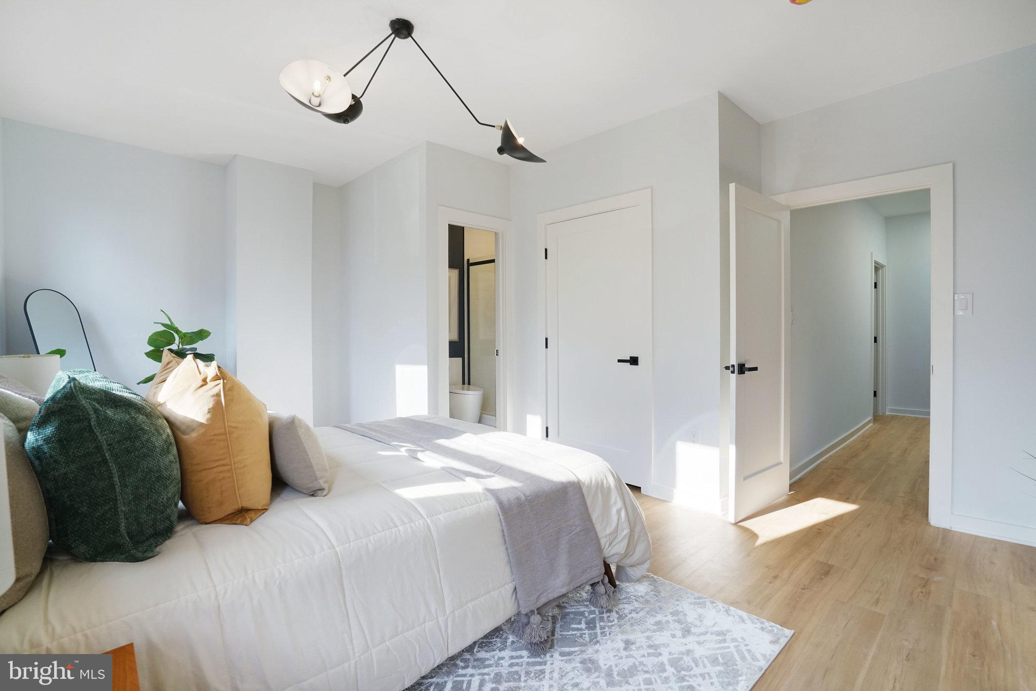 403 O Street Northwest Washington, DC 20001 - Photo 15 of 27 a bedroom with a bed and wooden floor