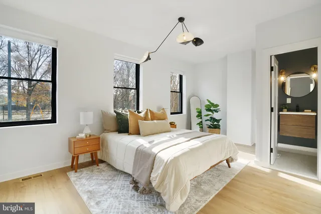 a bedroom with a bed and a view of bathroom