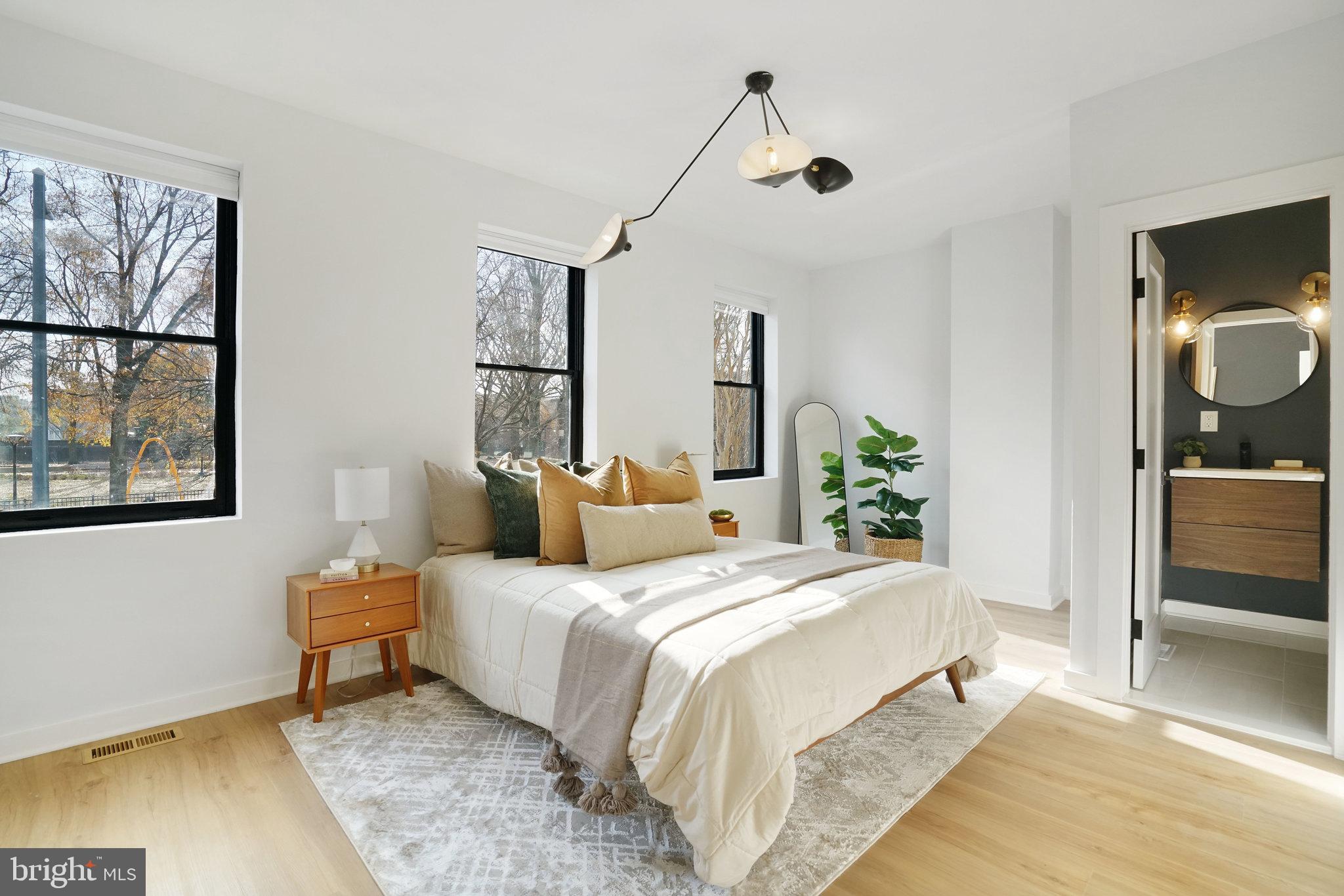 403 O Street Northwest Washington, DC 20001 - Photo 16 of 27 a bedroom with a bed and a view of bathroom