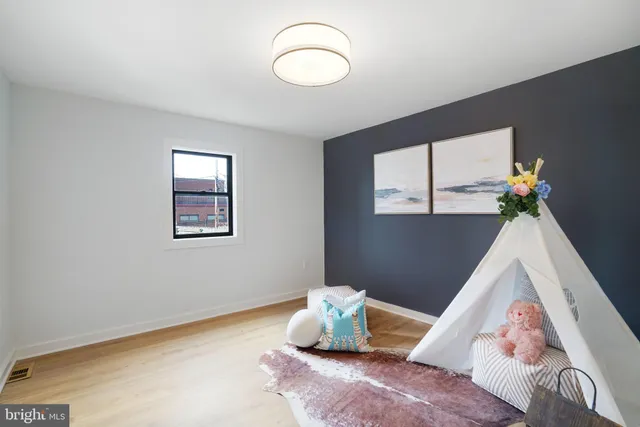 a bedroom with bed and a window