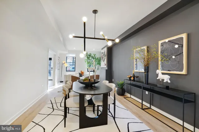 a dining room with furniture and window