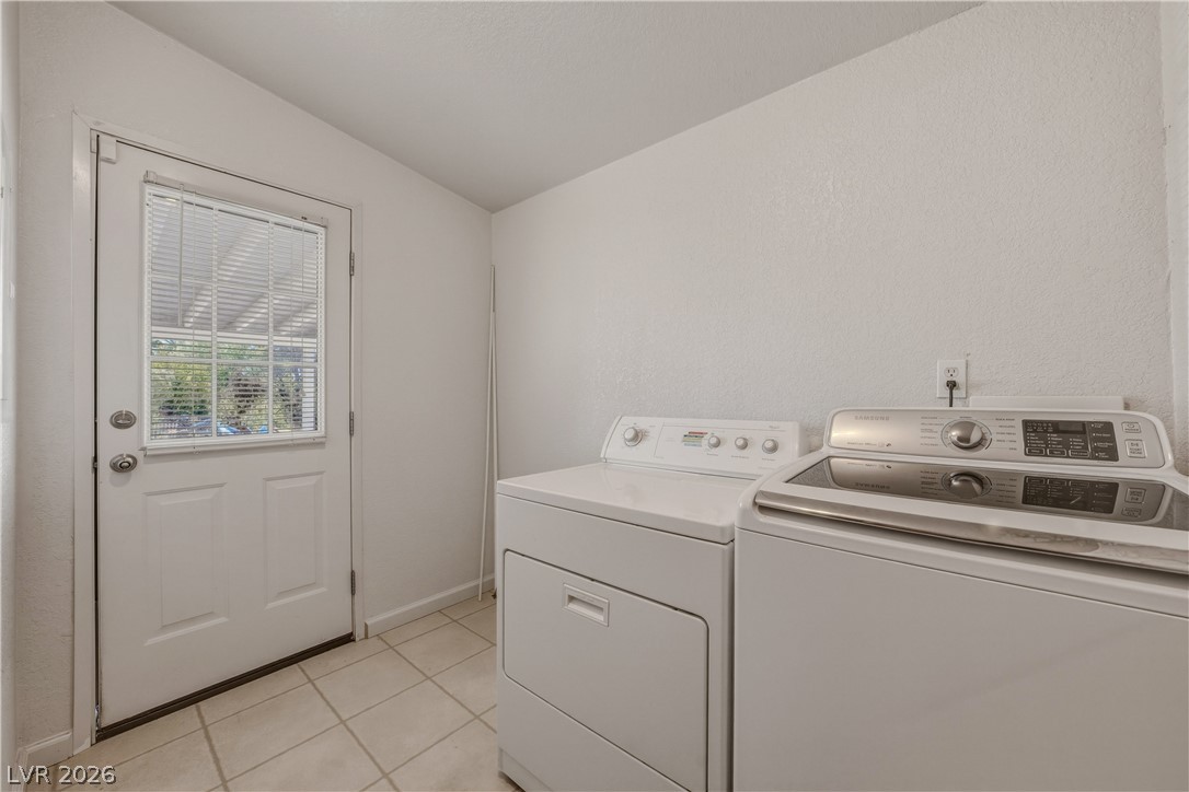 1890 West Dyer Road Pahrump, NV 89048 - Photo 10 of 40 This functional laundry area features convenient access to the outdoors, streamlining daily tasks.