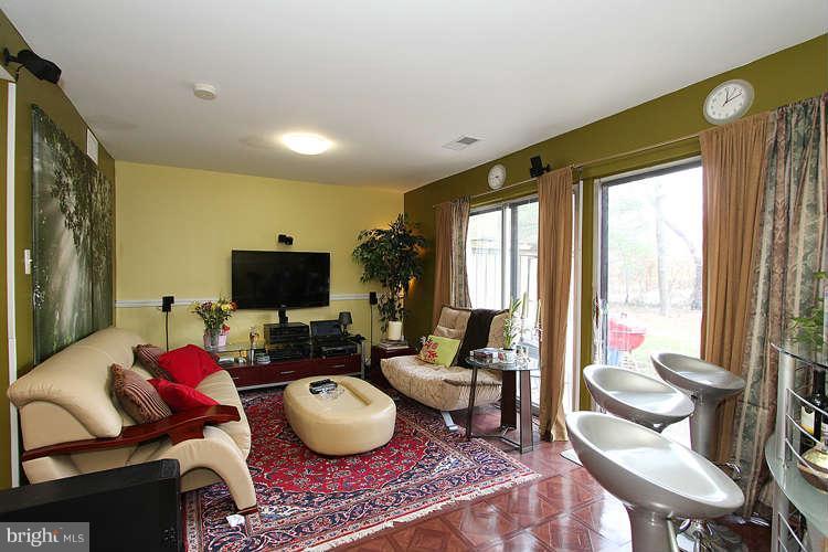 3343 Claridge Court Silver Spring, MD 20902 - Photo 11 of 20 a living room with furniture and a flat screen tv
