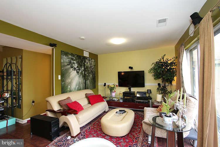 3343 Claridge Court Silver Spring, MD 20902 - Photo 12 of 20 a living room with furniture and a flat screen tv