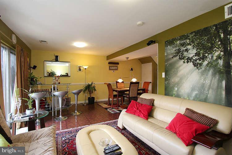 3343 Claridge Court Silver Spring, MD 20902 - Photo 13 of 20 a living room with furniture and a flat screen tv