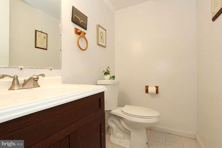 3343 Claridge Court Silver Spring, MD 20902 - Photo 15 of 20 a bathroom with a sink a toilet and mirror
