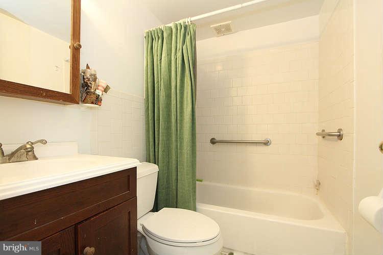 3343 Claridge Court Silver Spring, MD 20902 - Photo 18 of 20 a bathroom with a sink mirror toilet and bathtub