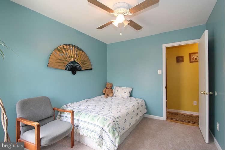 3343 Claridge Court Silver Spring, MD 20902 - Photo 20 of 20 a bedroom with a bed and a chair