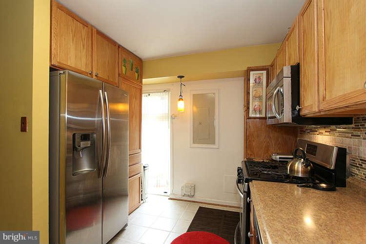 3343 Claridge Court Silver Spring, MD 20902 - Photo 8 of 20 a kitchen with stainless steel appliances granite countertop a refrigerator and a stove