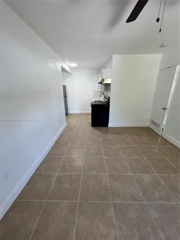 a view of kitchen with cabinets and wooden floor