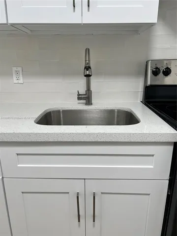 a close view of a sink and a stove