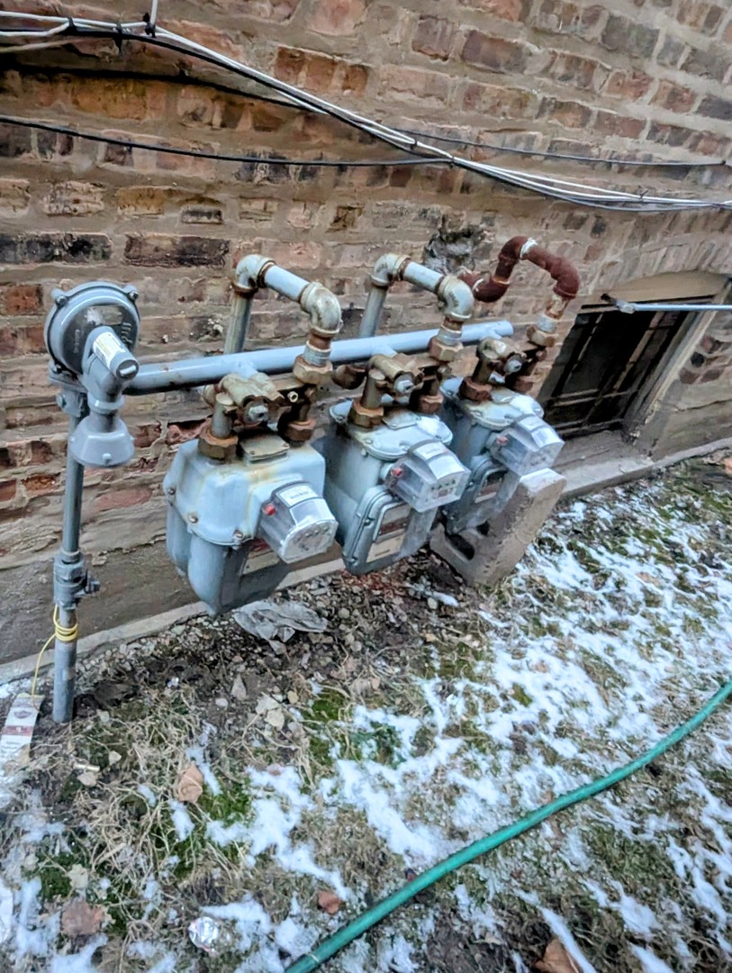 4949 West Iowa Street Chicago, IL 60651 - Photo 12 of 13 a backyard of a house with outdoor seating