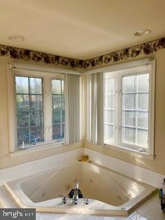 5113 Robins Perch Lane Perry Hall, MD 21128 - Photo 12 of 16 a bath tub sitting in a bathroom next to a window