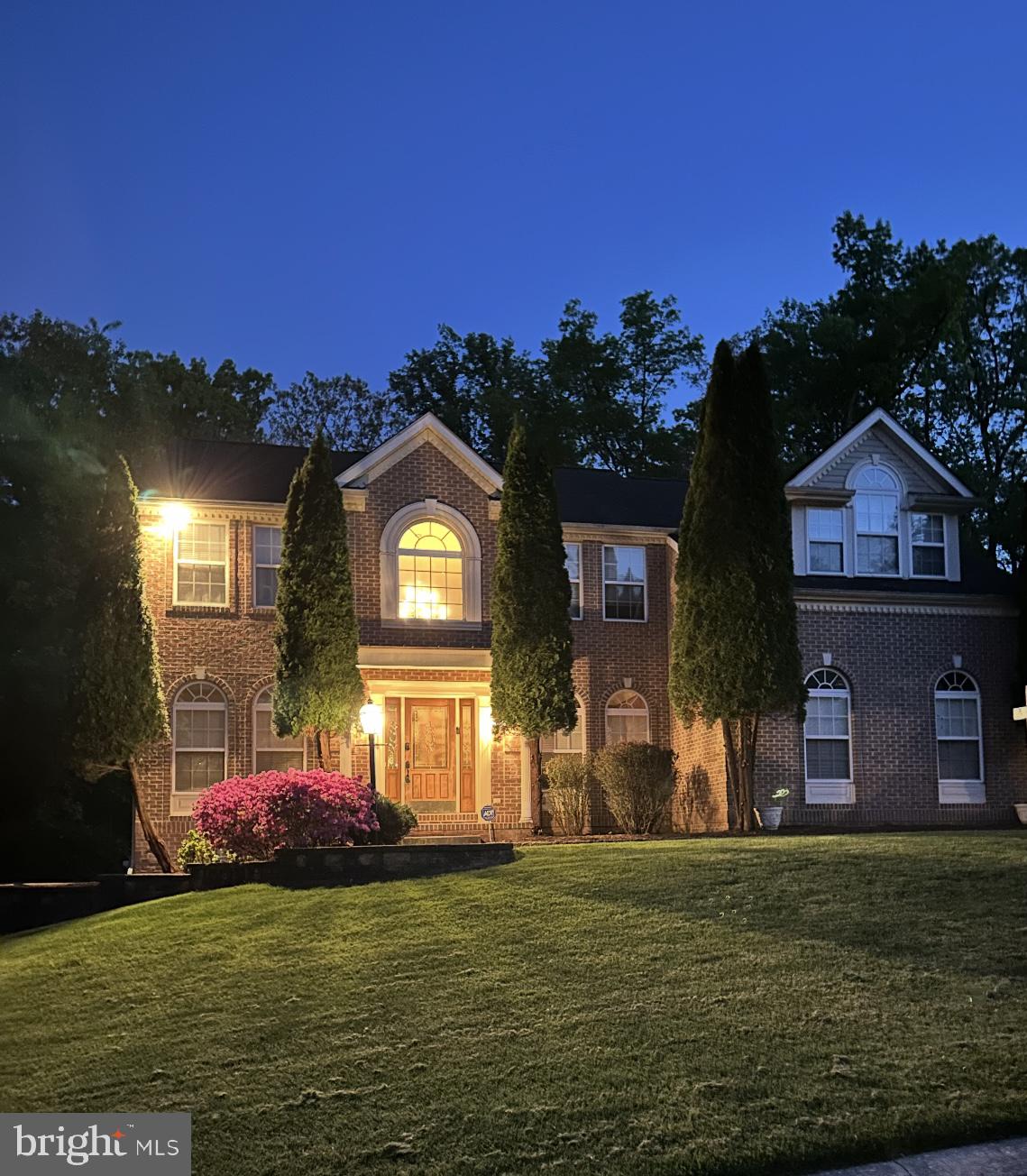 5113 Robins Perch Lane Perry Hall, MD 21128 - Photo 15 of 16 a front view of a house with a garden