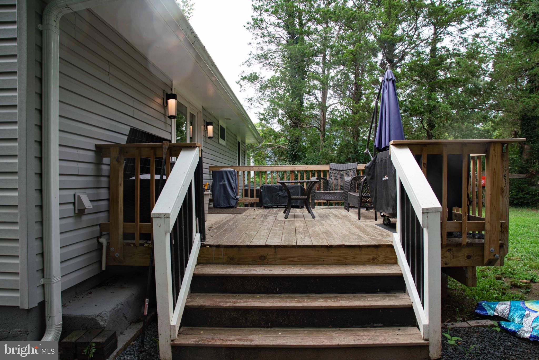 301 North Duey Road Remington, VA 22734 - Photo 32 of 38 Charming deck nestled in nature's embrace.