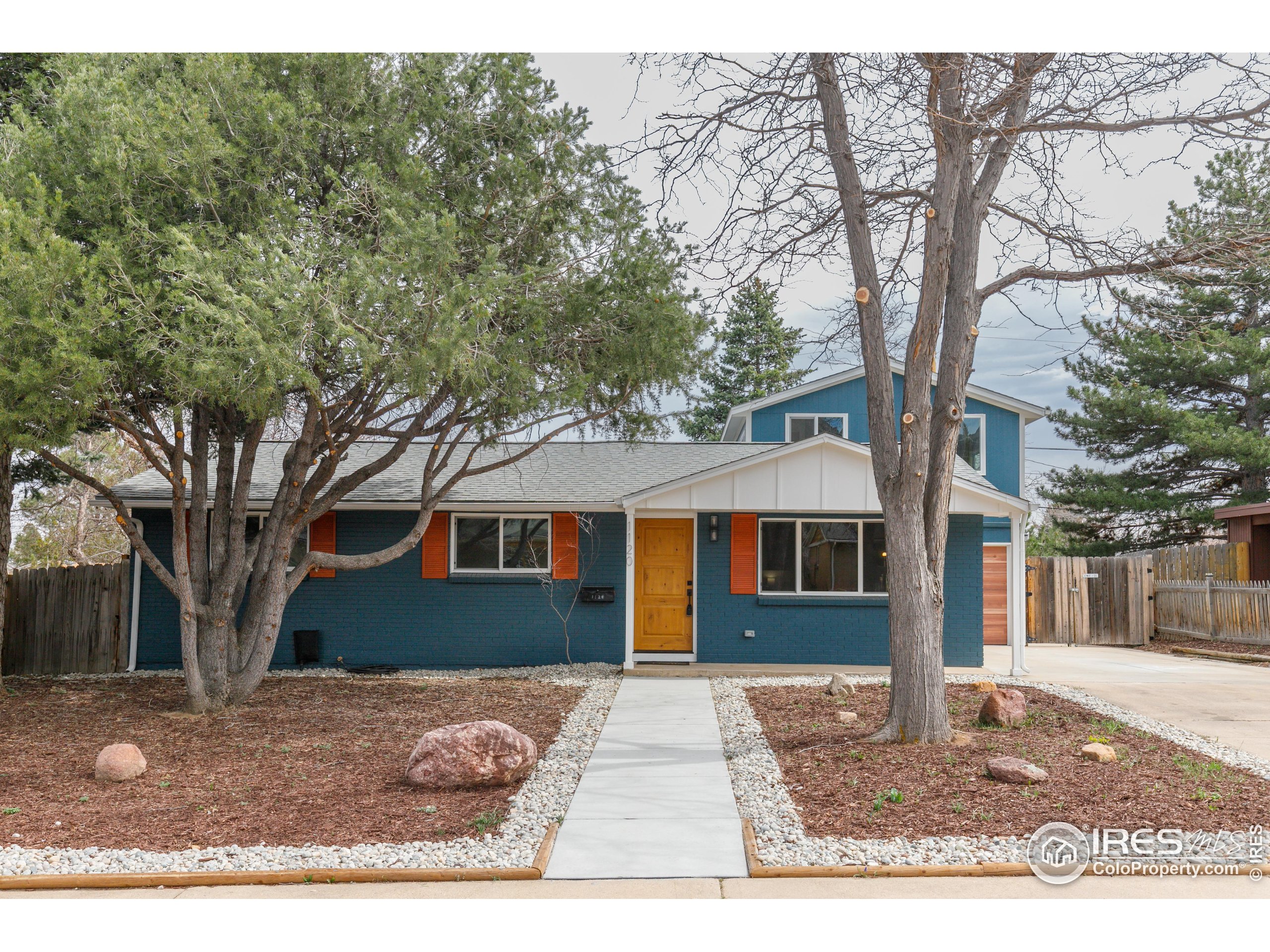 1120 Hartford Drive Boulder, CO 80305 - Photo 2 of 40 a front view of a house with a yard