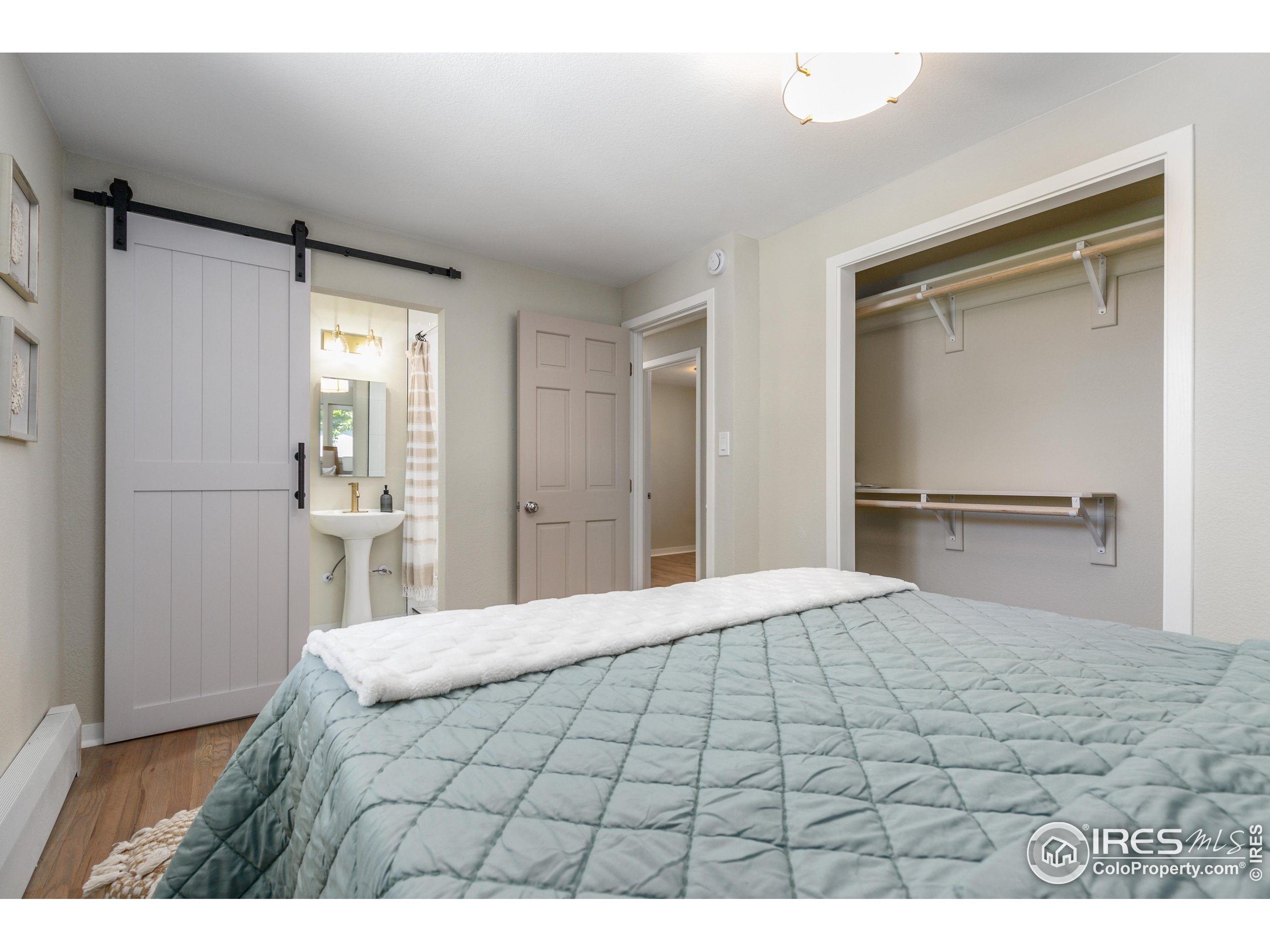 1120 Hartford Drive Boulder, CO 80305 - Photo 27 of 40 a bedroom with a bed and a table