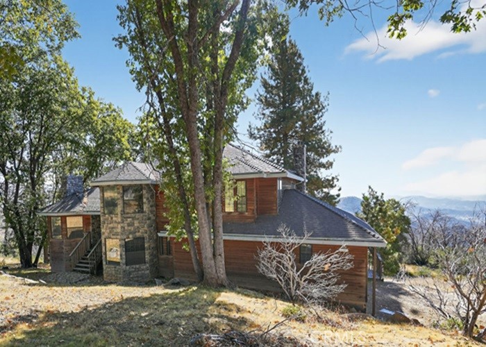43975 Auberry Road Auberry, CA 93602 - Photo 1 of 20 a front view of a house with a yard and garage