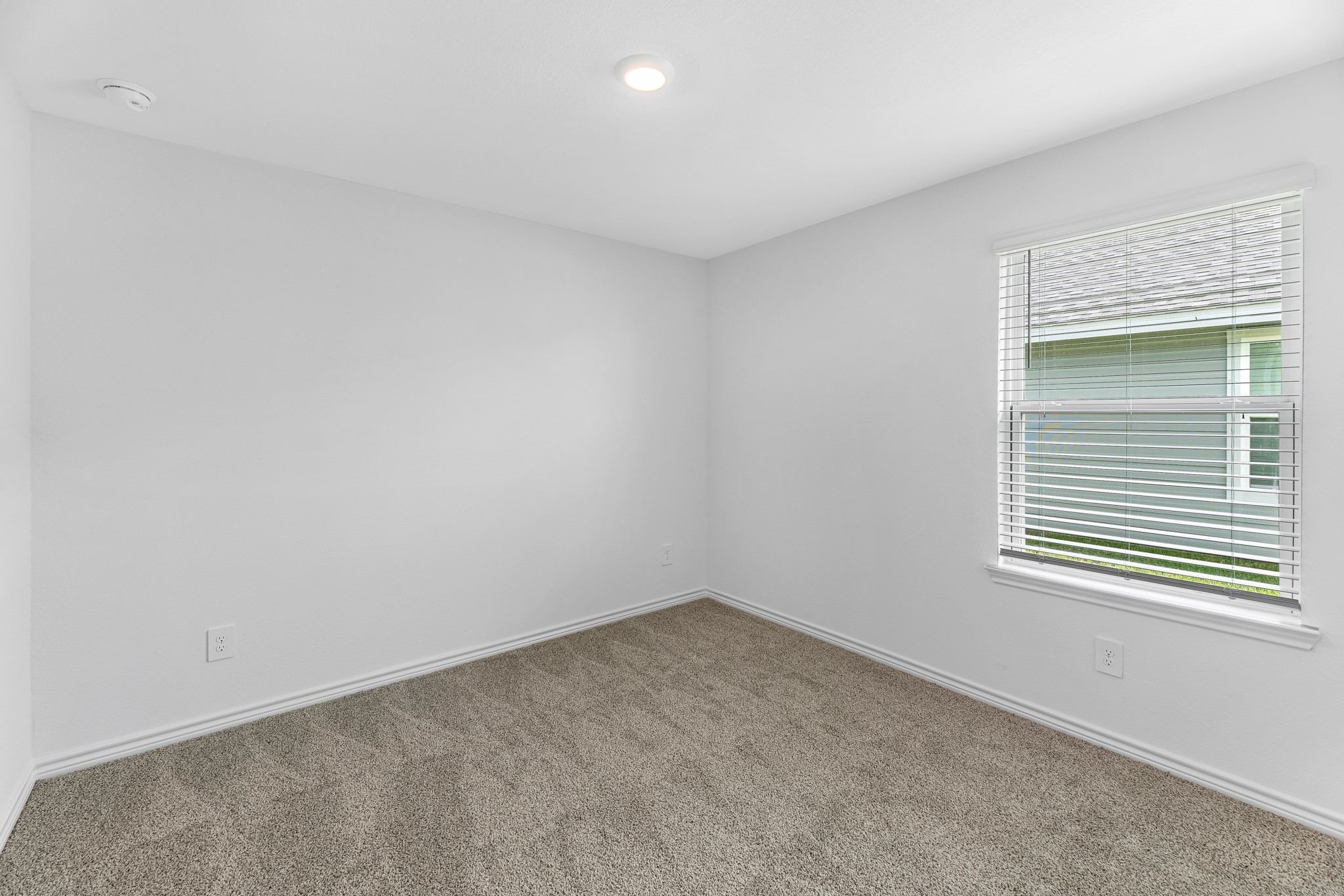 545 Hunter Grove Lane Beaumont, TX 77713 - Photo 12 of 26 an empty room with a window