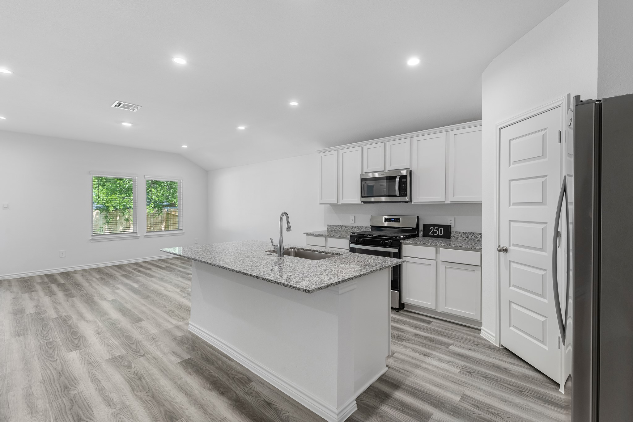 545 Hunter Grove Lane Beaumont, TX 77713 - Photo 2 of 26 a kitchen with stainless steel appliances granite countertop a refrigerator sink and stove