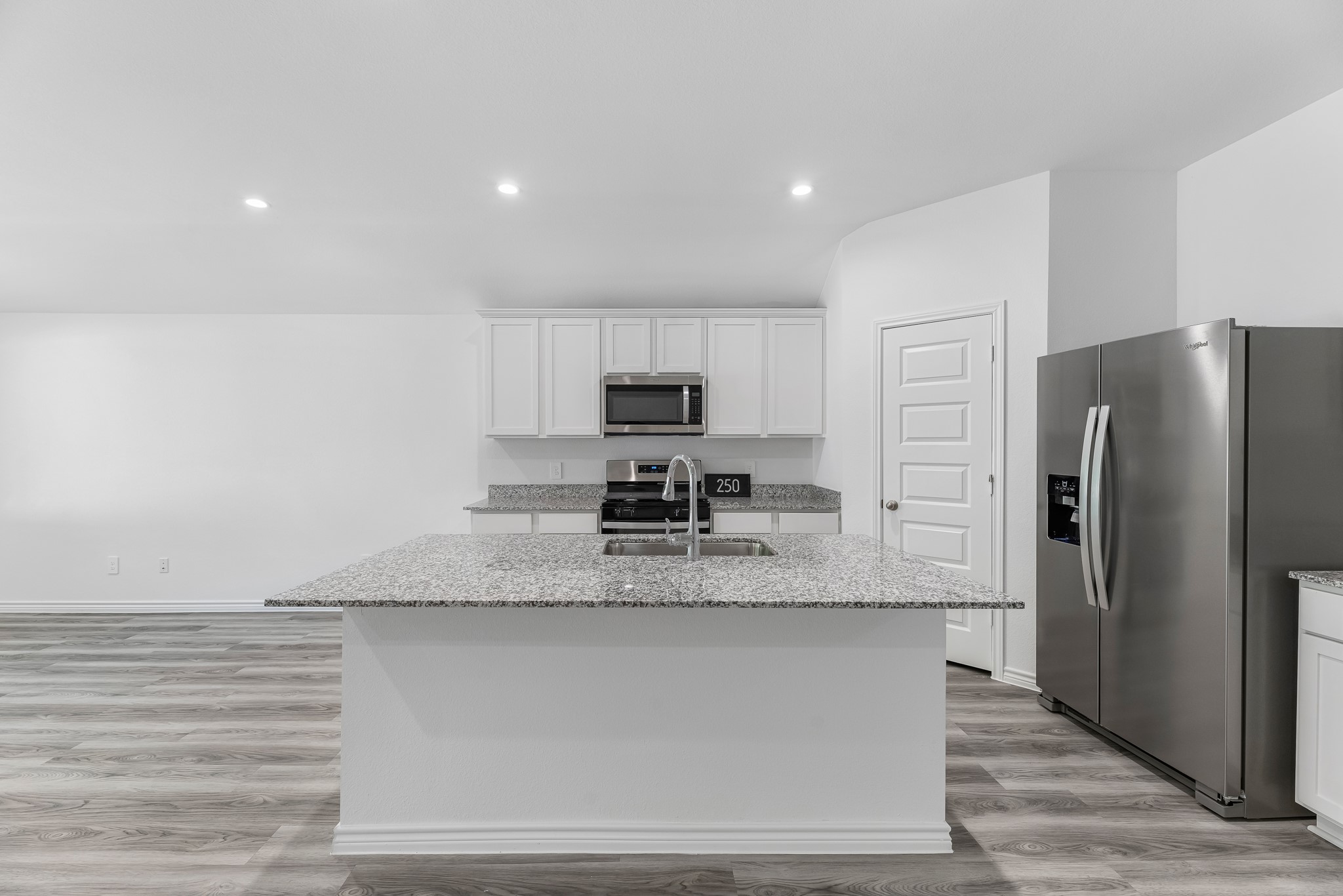 545 Hunter Grove Lane Beaumont, TX 77713 - Photo 3 of 26 a kitchen with stainless steel appliances granite countertop a refrigerator a stove and a sink with wooden cabinets