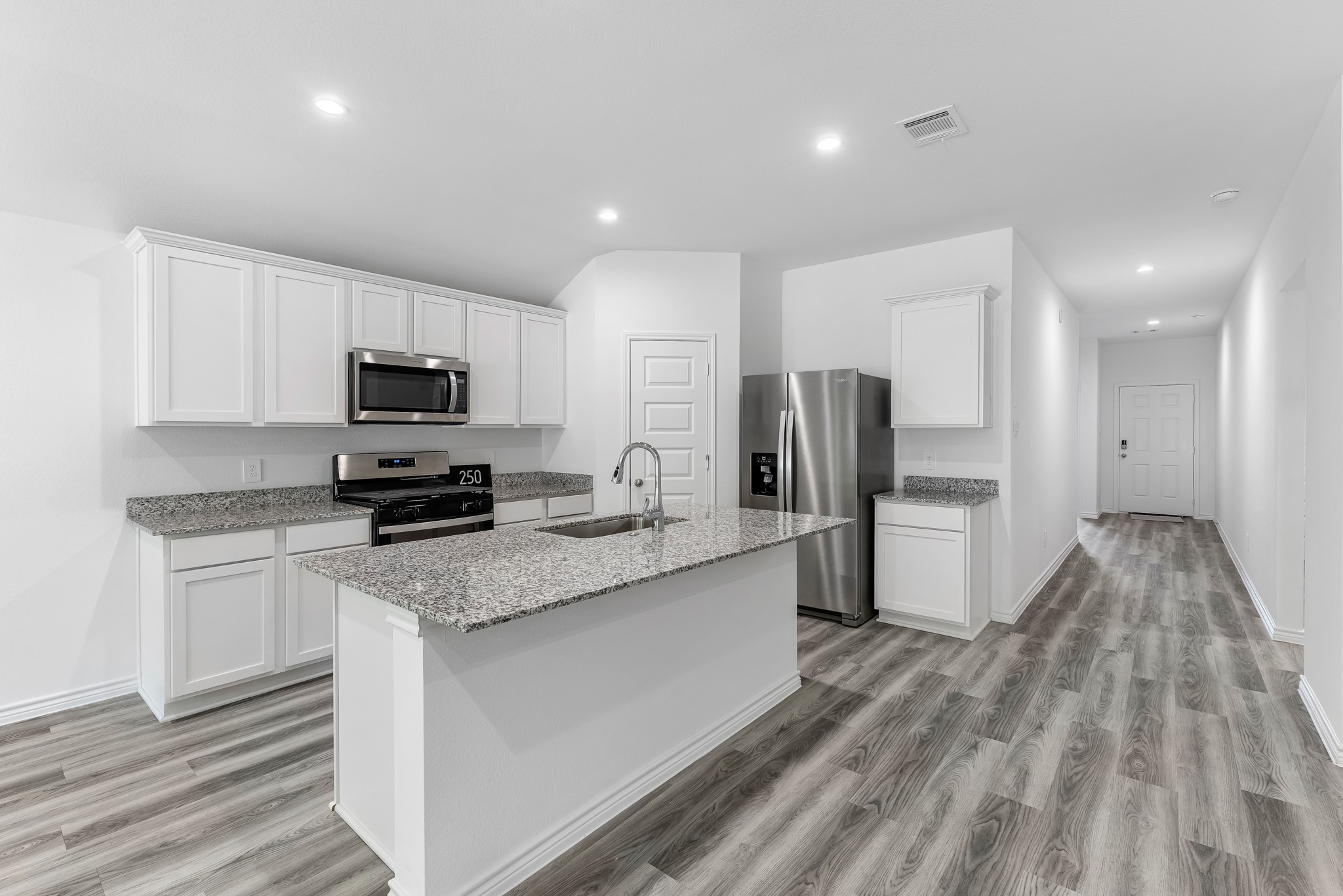 545 Hunter Grove Lane Beaumont, TX 77713 - Photo 4 of 26 a kitchen with stainless steel appliances a refrigerator sink and microwave