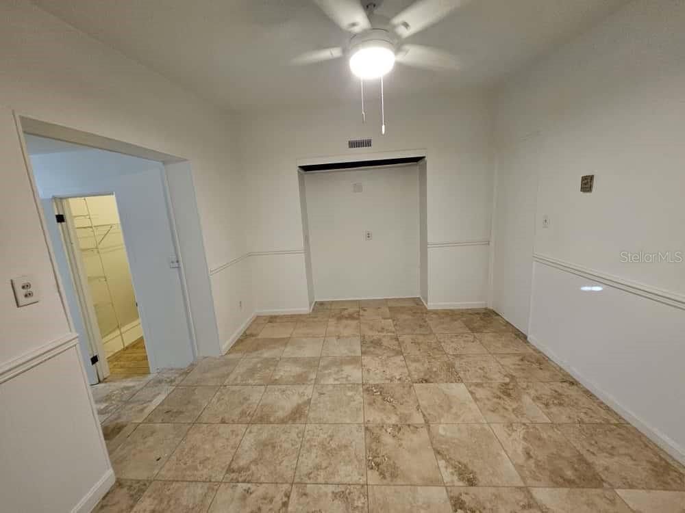 7406 Nolton Way Orlando, FL 32822 - Photo 6 of 10 a view of a livingroom with wooden floor and a ceiling fan