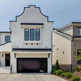 a front view of a house with a garage